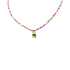 Necklace with pink beads and lock charm