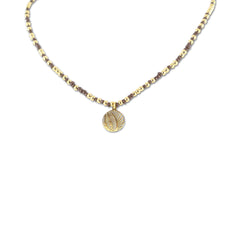 Necklace with brown beads and charm