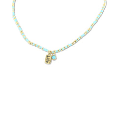 Ketting met turkooizen kralen en levensbedel